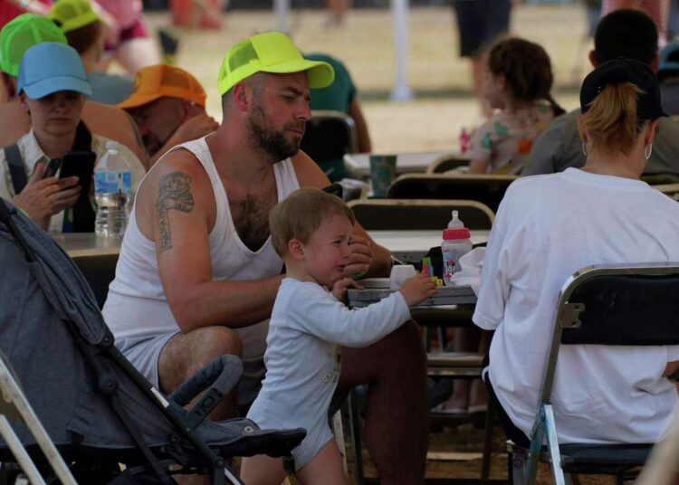 Ukrainian refugees rest at a refugee camp in Utopia Park, Iztapalapa, Mexico City on May 2, 2022.