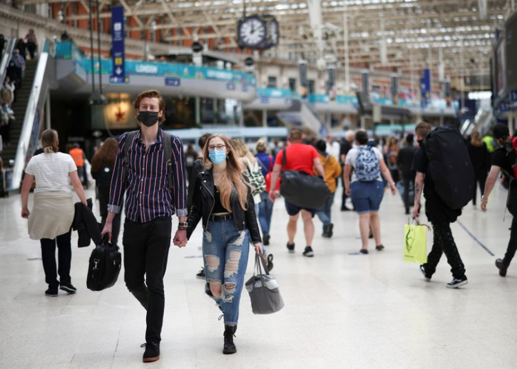 Covid-19 cases exceed 516 million worldwide - JHU 1 - Egyptian Gazette People, some wearing protective face masks, walk through Waterloo Station, amid the coronavirus disease (COVID-19) pandemic, in London, Britain, July 4, 2021.