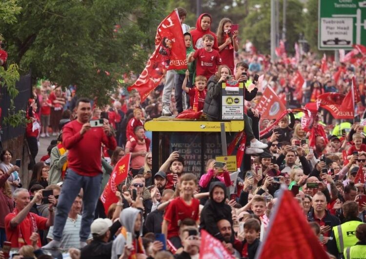 Liverpool fans caused initial problems at Champions League final, says French minister 1 - Egyptian Gazette Liverpool fans celebrate on top of a bus stop during the teams victory parade in Liverpool May 29, 2022.