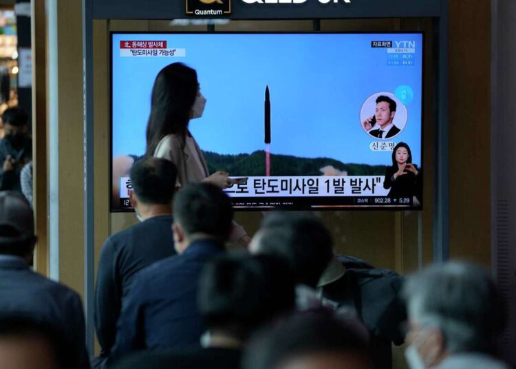 North Korea fires ballistic missile amid rising animosities 1 - Egyptian Gazette People watch a TV screen showing a news program reporting about North Korea's missile launch with file footage, at a train station in Seoul, South Korea, Wednesday, May 4, 2022.