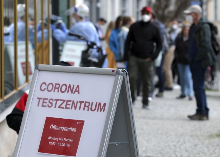 A file photo shows people queue outside a COVID-19 rapid test centre to get a day pass to visit shops and cultural institutions, as the spread of the coronavirus disease (COVID-19) continues in Weimar, Germany, March 29, 2021.