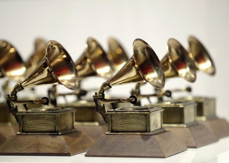 FILE - Grammy Awards are displayed at the Grammy Museum Experience at Prudential Center in Newark, N.J. on Oct. 10, 2017. The Grammys are adding a special song for social change award and five new categories including songwriter of the year, giving the Recording Academy an avenue to honour music’s best composer.