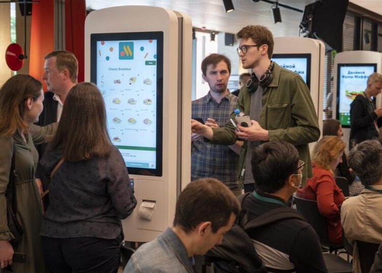 Visitors order food at a newly opened fast food restaurant in a former McDonald's outlet in Bolshaya Bronnaya Street in Moscow, Russia.