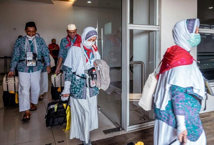 Indonesians prepare to depart from Juanda International Airport in Surabaya, as part of the first batch of hajj pilgrims since before the coronavirus pandemic.