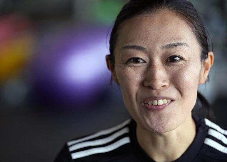 Yoshimi Yamashita of Japan, one of three women picked to be head referees at the men's soccer World Cup, speaks during an interview withe The Associated Press Monday, June 27, 2022, at JFA YUME Field in Chiba, near Tokyo.