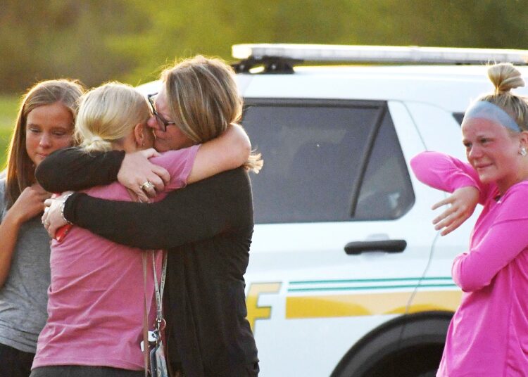 3 dead, including gunman, in shooting outside Iowa church 1 - Egyptian Gazette People console each other after a shooting outside Cornerstone Church on June 2, 2022 in Ames, Iowa.