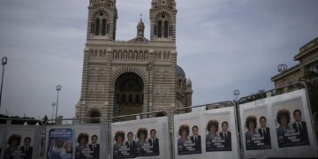 French voters elect parliamentarians, in test for Macron