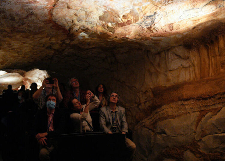 Exhibit of famed prehistoric cave to open in Marseille 1 - Egyptian Gazette Journalists attend a tour of in a replica of the Cosquer Cave in the Villa Mediterranee in Marseille, southern France, on June 2, 2022.