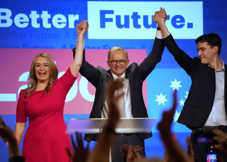 Labour Party leader Anthony Albanese, (C), celebrates with his son Nathan, (R), and his partner Jodie Haydon at a Labour Party event in Sydney, Australia, on May 22, 2022, after then Prime Minister Scott Morrison conceding defeat to Albanese in a federal election.