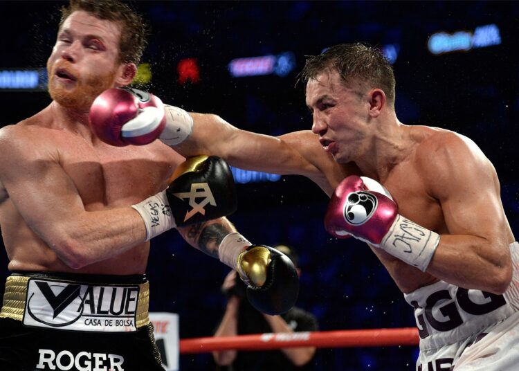 A file photo shows Canelo Alvarez (black trunks) and Gennady Golovkin in action during the middleweight world championship boxing match in Las Vegas.