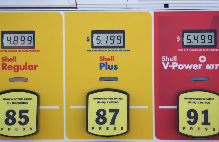 The prices are displayed over the various grades of gasoline available at a Shell station, on June 8, 2022, in Englewood, Colo.