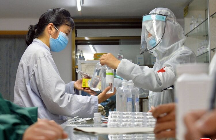 WHO says COVID in N. Korea likely 'getting worse, not better' 1 - Egyptian Gazette Army medics involved in medicine supply distribution work at a pharmacy in Pyongyang on May 23, 2022.