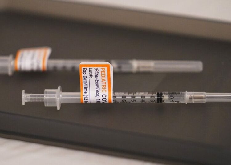 1st shots for kids under 5 possible by June 21 1 - Egyptian Gazette Prepared Pfizer COVID-19 vaccine syringes for children ages 5 to 11 and adults are displayed on a table at Northwest Community Church in Chicago, Dec. 11, 2021.