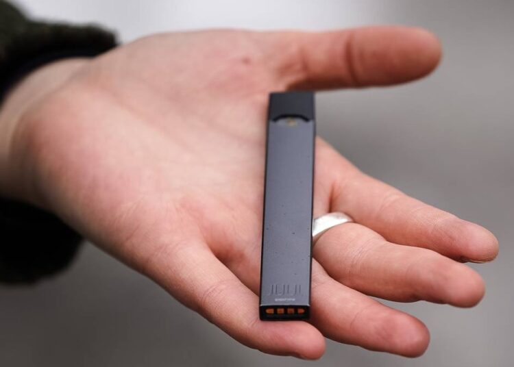 An electronic cigarette from Juul Labs is seen on Tuesday, Feb. 25, 2020, in Pembroke Pines, Fla.