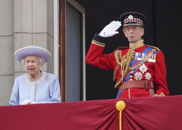 Queen Elizabeth II and the Duke of Kent watch from the balcony of Buckingham Palace after the Trooping the Color ceremony in London, Thursday, June 2, 2022, on the first of four days of celebrations to mark the Platinum Jubilee. The events over a long holiday weekend in the U.K. are meant to celebrate the monarch's 70 years of service.