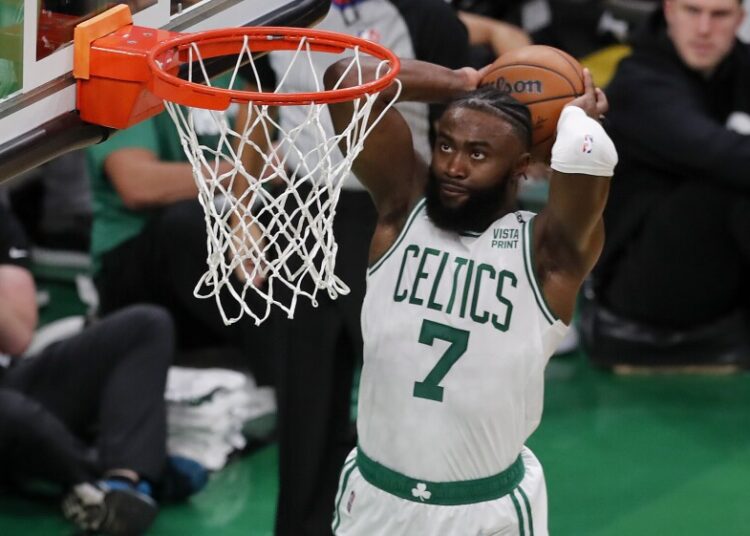 Boston Celtics guard Jaylen Brown (7) dunks the ball against the Golden State Warriors during Game 3 of the NBA Finals in Boston.