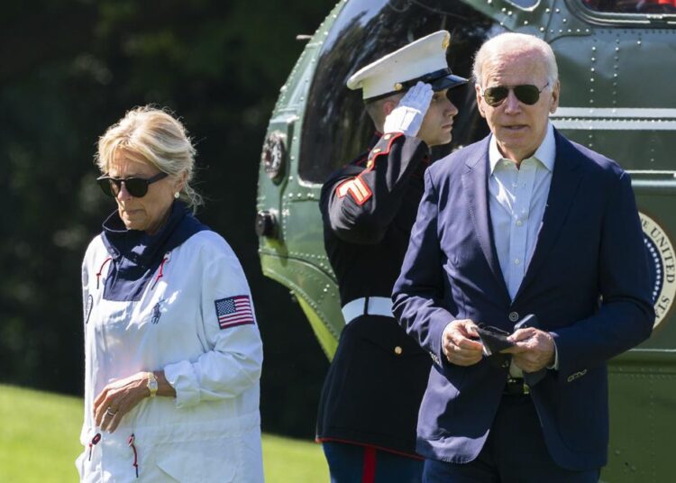 President Joe Biden and first lady Jill Biden walk on the South Lawn upon arrival at the White House from Rehoboth Beach, Del., Sunday, June 5, 2022, in Washington.