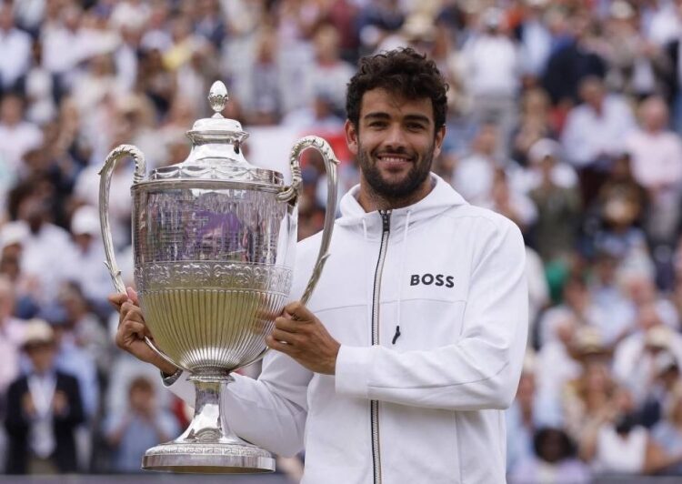 Italy's Matteo Berrettini celebrates with the trophy after winning his final match against Serbia's Filip Krajinovic.