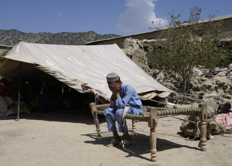 Afghan boy sits in a courtyard of her destroyed home after an earthquake in Gayan district in Paktika province, Afghanistan, Sunday, June 26, 2022. A powerful earthquake struck a rugged, mountainous region of eastern Afghanistan early Wednesday, flattening stone and mud-brick homes in the country's deadliest quake in two decades, the state-run news agency reported.