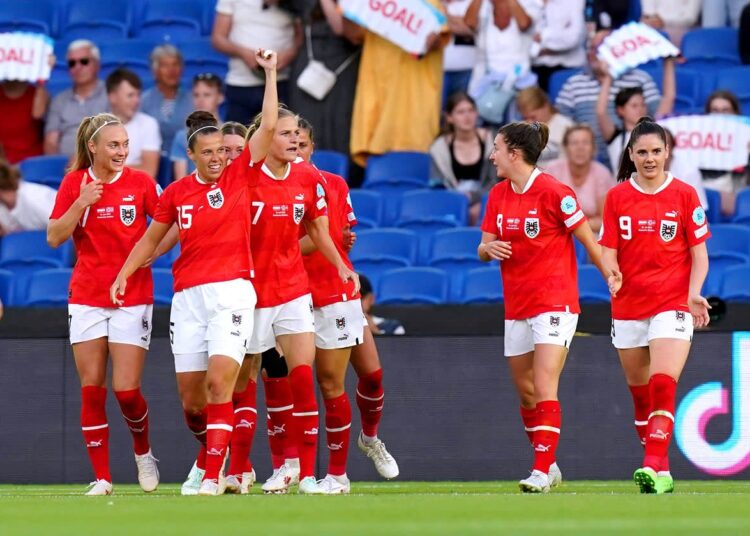 Austria’s players celebrate after scoring a goal against Norway.