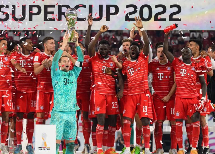 Bayern Munich grabs German Super Cup 1 - Egyptian Gazette Goalkeeper Manuel Neuer lifts German Super Cup trophy as Bayern Munich’s players celebrate victory over Leipzig.