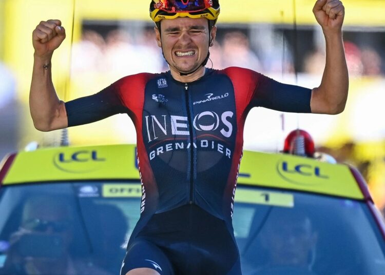 Thomas Pidcock celebrates as he crosses the finish line of the 12th stage of the Tour de France cycling race over 165.5 kilometers with start in Briancon and finish in Alpe d'Huez, France.