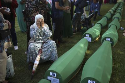 Thousands gather to mark Srebrenica massacre, bury victims