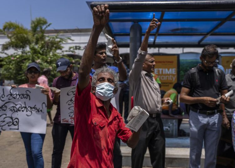 Trade union representatives and activists shout slogans during a protest against Sri Lanka’s acting president Ranil Wickremesinghe in Colombo, Sri Lanka, Monday, July 18, 2022. Wickremesinghe on Monday declared a state of emergency giving him broad authority amid growing protests demanding his resignation two days before the country's lawmakers are set to elect a new president.
