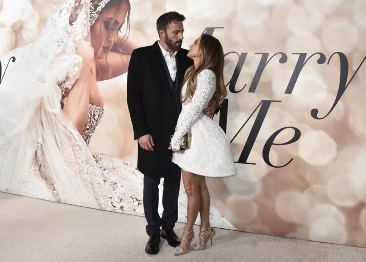 FILE - Cast member Jennifer Lopez, right, and Ben Affleck attend a photo call for a special screening of "Marry Me" at DGA Theater on Feb. 8, 2022, in Los Angeles. The couple have obtained a marriage license in Nevada, according to court records posted Sunday, July 17, 2022.