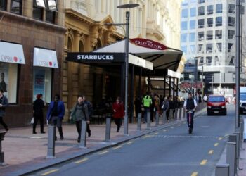 New Zealand announces free masks, tests as health system struggles with Covid