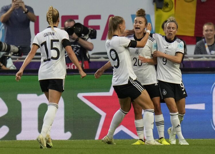 Germany's players celebrate after scoring during the Women Euro 2022 quarter-final match against Austria in London.