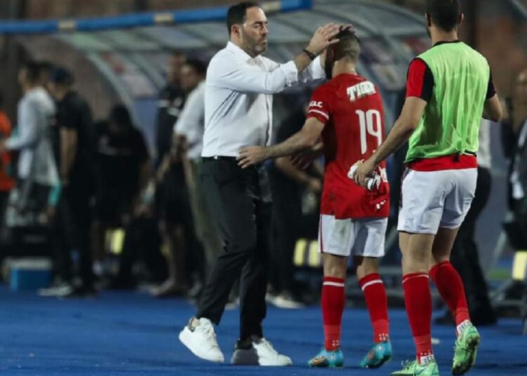 Al-Ahly player Mohamed Magdy ‘Afsha’ (C) celebrates with his coach Ricardo Soares after scoring his side’s first goal against Petrojet.