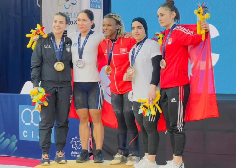 Mediterranean Games: Athletes adds 2 medals; raises Egypt’s tally to 34 medals 1 - Egyptian Gazette Weightlifter Basma Ibrahim (2nd R) posing with the bronze medal in the 59kg competitions.