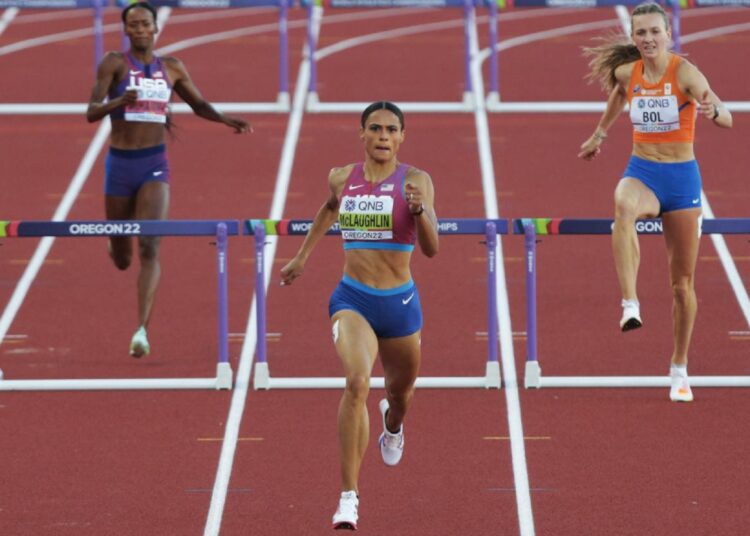 McLaughlin smashes world record as Shaunae wins 400m gold 1 - Egyptian Gazette Sydney McLaughlin (C) clears 10th and last hurdle on way to stunning world record at World Athletics Championships in Oregon.
