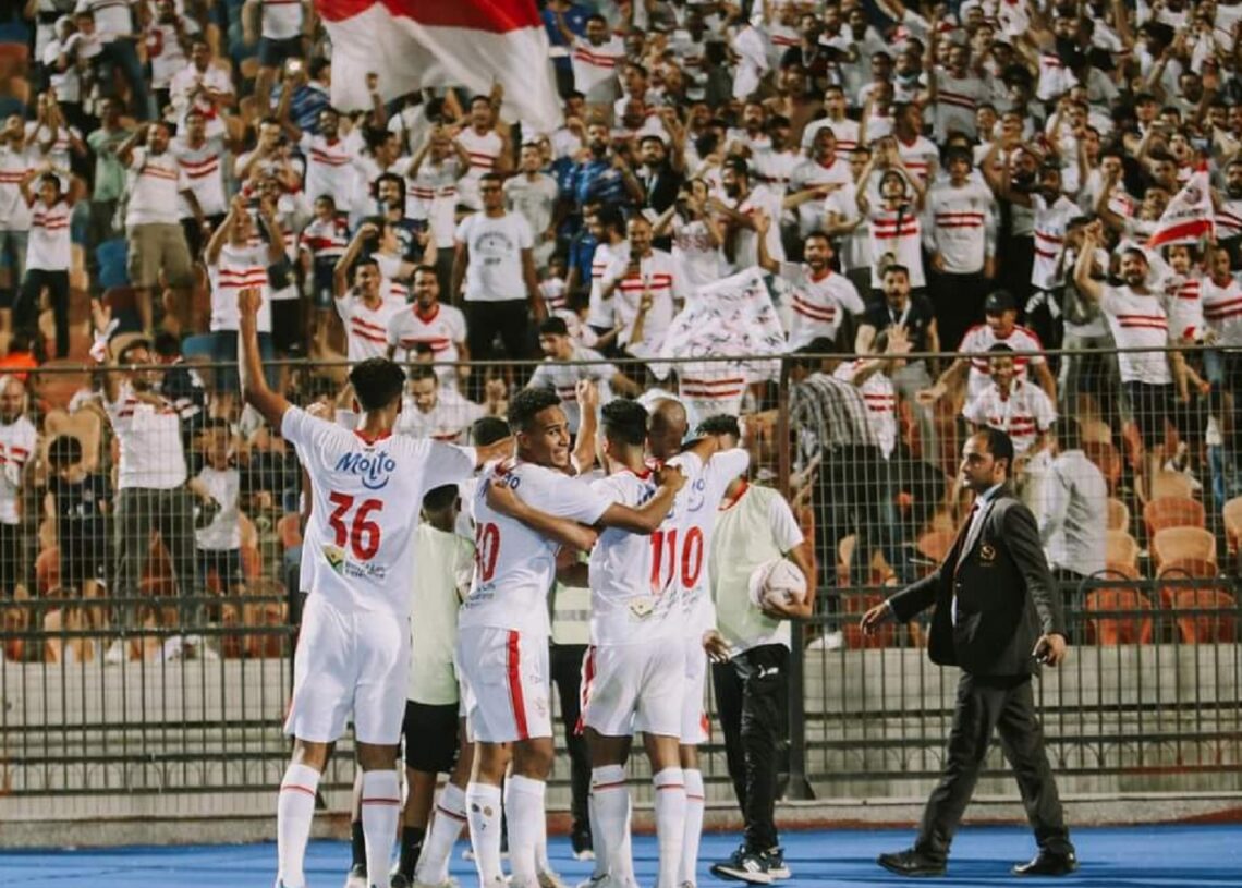 Zamalek’s players celebrating with the fans after scoring against Smouha during their match at Cairo International Stadium.