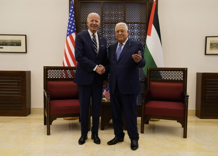 Biden arrives in Ramallah to meet Palestinian president 1 - Egyptian Gazette Palestinian President Mahmoud Abbas and US President Joe Biden shake hands in the West Bank town of Bethlehem, Friday, July 15, 2022.