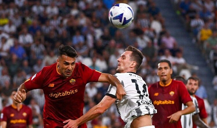 AS Roma's Zeki Celik (L) and Juventus' Arkadiusz Milik vying for the ball during their Italian Serie A match in Turin.