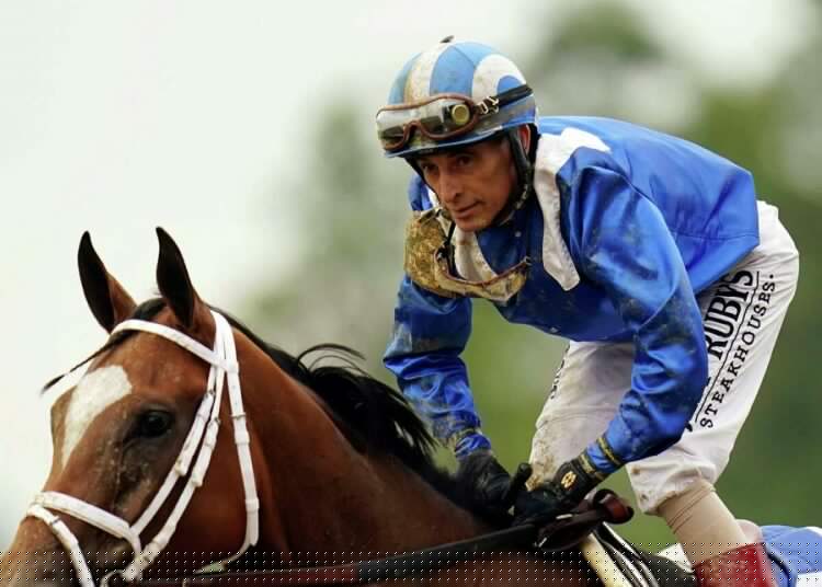 John Velazquez, top, rides during the Belmont Stakes, June 11, 2022, in Elmont, New York. Velazquez, already the all-time leading rider at Saratoga, won his 1,000th career race on Aug. 25, 2022, at the upstate New York track.
