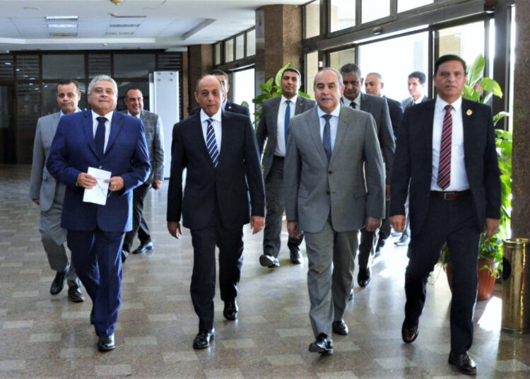 The newly-appointed minister of civil aviation Mohamed Abbas Helmy (2nd from left) and former civil aviation minister Mohamed Manar (2nd from right) seen at the headquarter of EgyptAir company.