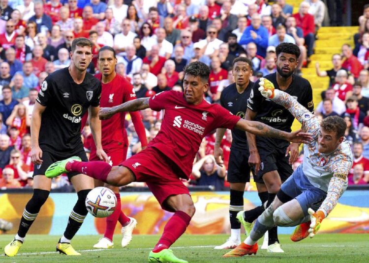 Liverpool's Roberto Firmino (C) scores their side's seventh goal of the game during the English Premier League match against Bournemouth in Liverpool.