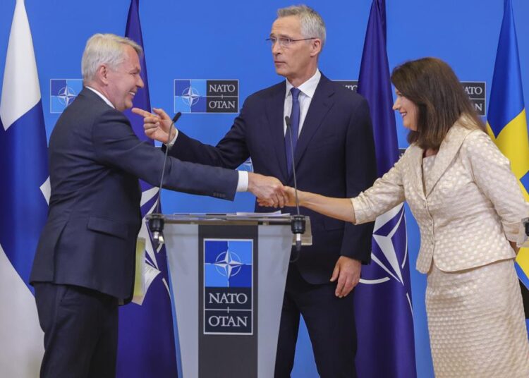 Finland's Foreign Minister Pekka Haavisto, (L), Sweden's Foreign Minister Ann Linde, (R), and NATO Secretary General Jens Stoltenberg attend a media conference after the signature of the NATO Accession Protocols for Finland and Sweden in the NATO headquarters in Brussels, July 5, 2022.
