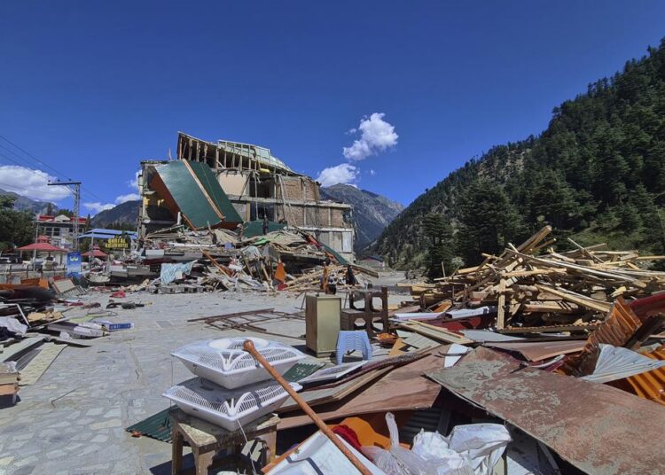 UN to seek $160 million in emergency aid for Pakistan floods 1 - Egyptian Gazette People salvage usable items from a damaged hotel building caused by floodwaters, in Kalam in Swat Valley, Pakistan, on Tuesday, August 30, 2022.