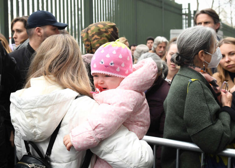 OFFI: Nearly 99,000 Ukrainian refugees arrive in France 1 - Egyptian Gazette Ukrainians queue outside a refugee welcome center in Paris on March 17, 2022 as the number of refugees fleeing Ukraine since Russia's invasion has grown by more than 100,000 over the past 24 hours, the United Nations says, calling the outflow of more than three million people a "heartbreaking crisis". (Photo by ALAIN JOCARD / AFP)