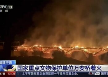 Fire engulfs historic wooden bridge in southern China