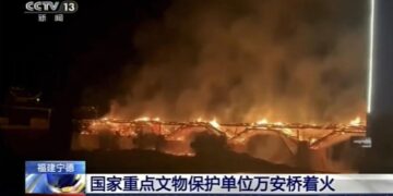 Fire engulfs historic wooden bridge in southern China