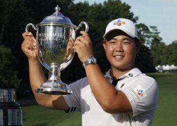 Kim arrives on PGA Tour with 61 to win Wyndham Championship