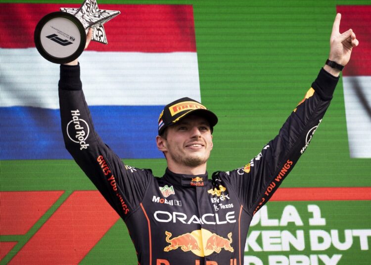 Max Verstappen lifts his trophy after winning the Formula One Dutch Grand Prix in Zandvoort, Netherlands.