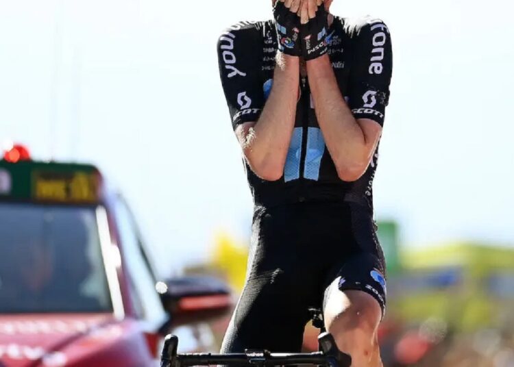 Thymen Arensman celebrates after he crosses the finish line at the 15th stage of the La Vuelta cycling tour of Spain in Monachil.