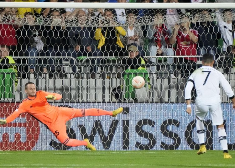 Manchester United's Cristiano Ronaldo scores his side's second goal from the penalty spot in Chisinau, Moldova.