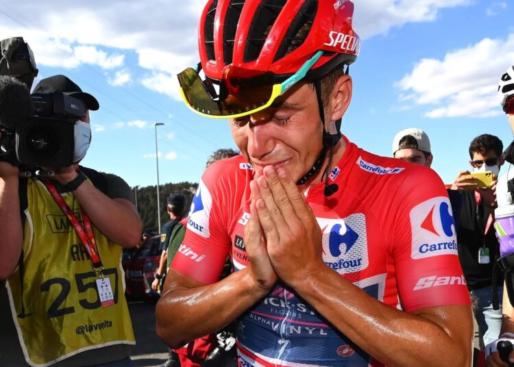 Remco Evenepoel is overcome with emotion after all but ending Belgium’s 44-year wait for a Grand Tour title.